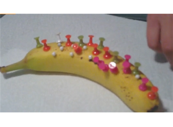 Most Thumbtacks Stuck Into A Banana